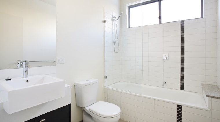 The contempoary design ogf the aprtments extends to bathroom, bathroom accessory, bathroom cabinet, bathroom sink, floor, interior design, plumbing fixture, product design, property, room, sink, tap, tile, wall, window, white