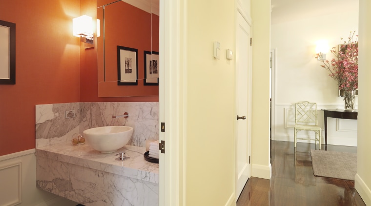 View of powder room with a marble vanity architecture, bathroom, ceiling, estate, floor, flooring, hardwood, home, interior design, laminate flooring, property, real estate, room, tile, wall, wood flooring, orange