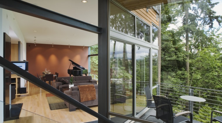 Floor-to-ceiling windows provide city views, and a sense architecture, daylighting, glass, house, interior design, real estate, window, gray, brown
