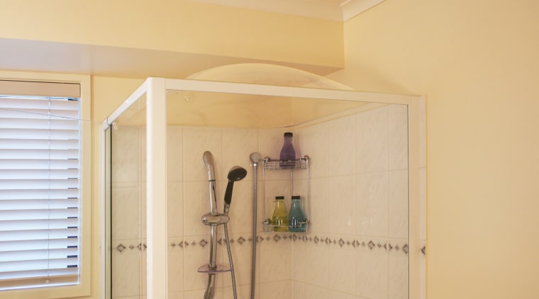 Image of a Showerdome shower which reduces the bathroom, ceiling, floor, home, interior design, plumbing fixture, property, room, wall, orange