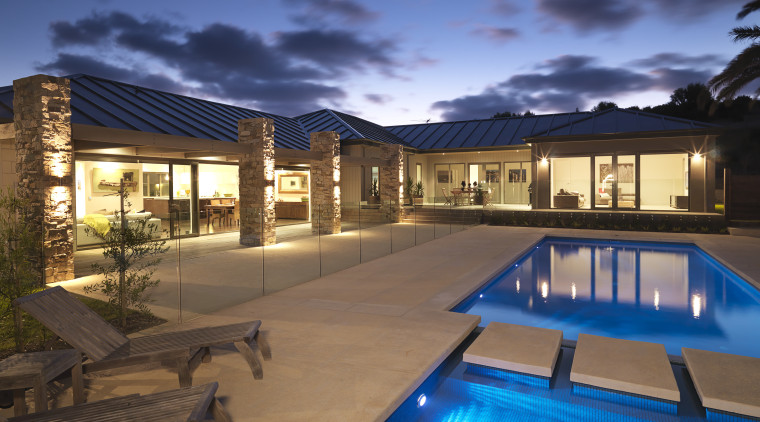 View of outdoor area, pool and spa which apartment, condominium, estate, home, hotel, house, landscape lighting, leisure, lighting, property, real estate, residential area, resort, resort town, sky, swimming pool, villa, blue, brown