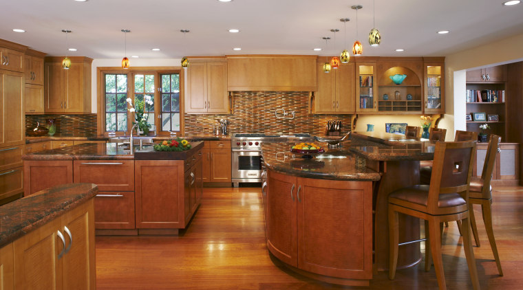 The kitchen is divided into a series of cabinetry, countertop, cuisine classique, flooring, hardwood, interior design, kitchen, real estate, room, wood, wood flooring, brown, gray
