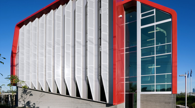 Vertical glass fins on the west facade help architecture, building, commercial building, corporate headquarters, daytime, facade, headquarters, landmark, metropolitan area, residential area, sky, structure, blue