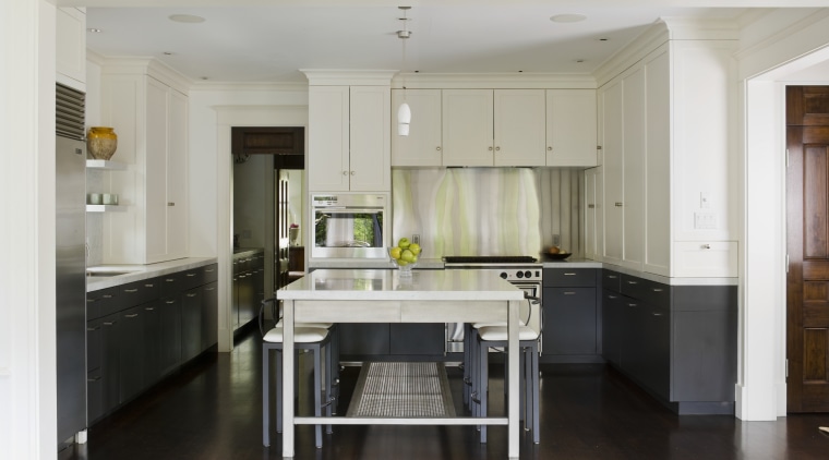 View of contemporary kitchen in this century-old house cabinetry, countertop, cuisine classique, floor, flooring, hardwood, interior design, kitchen, laminate flooring, room, wood flooring, gray, black