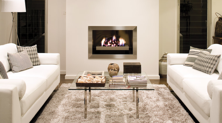 These Real Flame fireplaces, the Elegance and Pure couch, fireplace, floor, flooring, furniture, hearth, home, interior design, living room, room, table, white