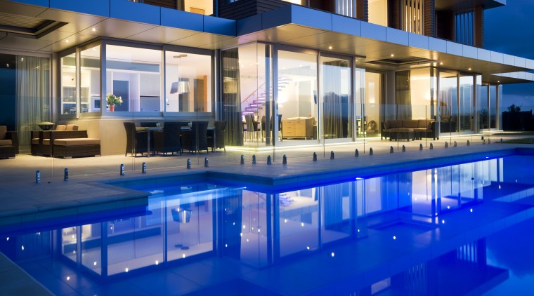 Lloyd Electrical installed the colour-changing LED electrics for apartment, architecture, condominium, corporate headquarters, estate, home, hotel, house, leisure, leisure centre, lighting, mixed use, property, real estate, reflection, resort, resort town, swimming pool, villa, blue