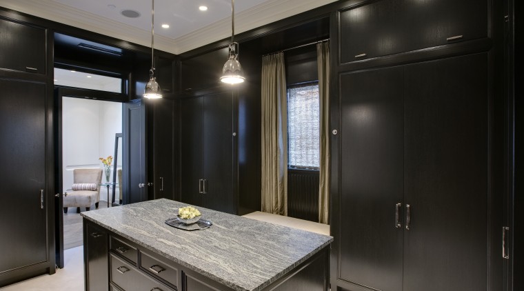 View of the dressing room featuring closets made cabinetry, countertop, interior design, kitchen, room, black, gray
