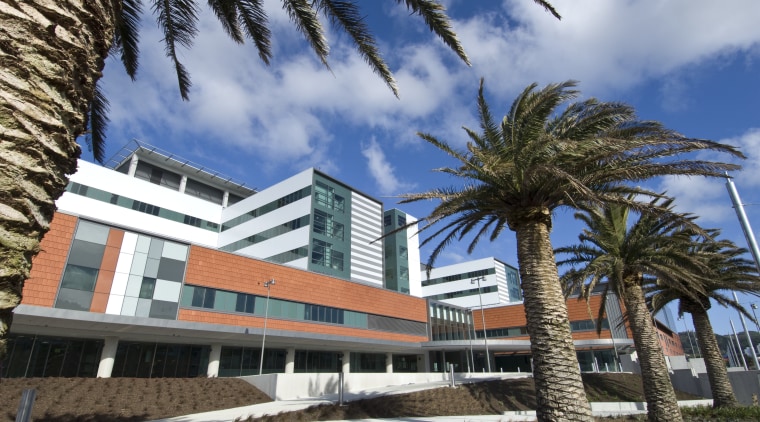 The new Wellington Regional Hospital was designed by apartment, arecales, building, condominium, home, hotel, mixed use, palm tree, property, real estate, resort, tree, teal, black