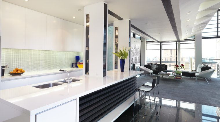 Image of this sleek modern kitchen which has countertop, interior design, kitchen, real estate, white
