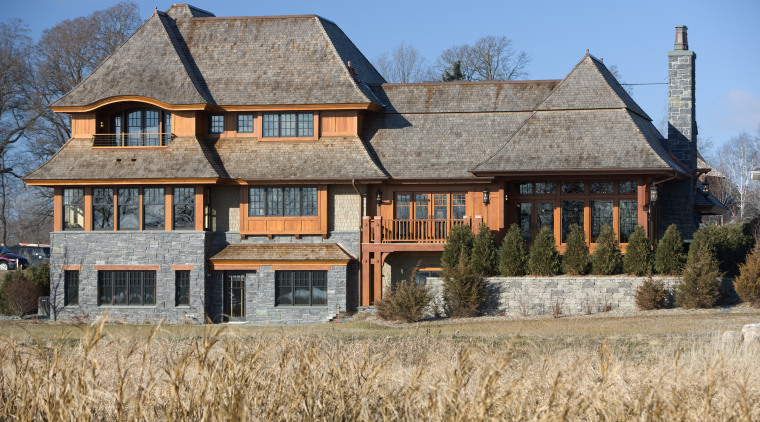 Exterior view of this home designed by Charlie building, cottage, estate, facade, farmhouse, home, house, mansion, property, real estate, roof