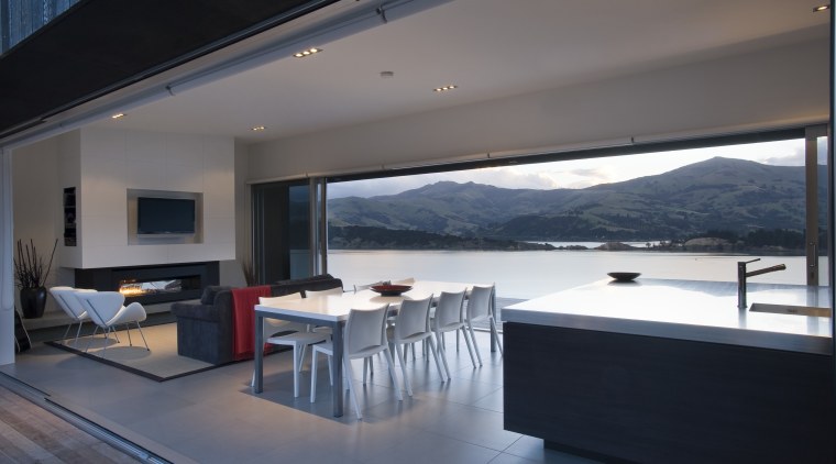 View of open-plan living, kitchen and dining area, architecture, floor, house, interior design, living room, penthouse apartment, property, real estate, window, gray, black