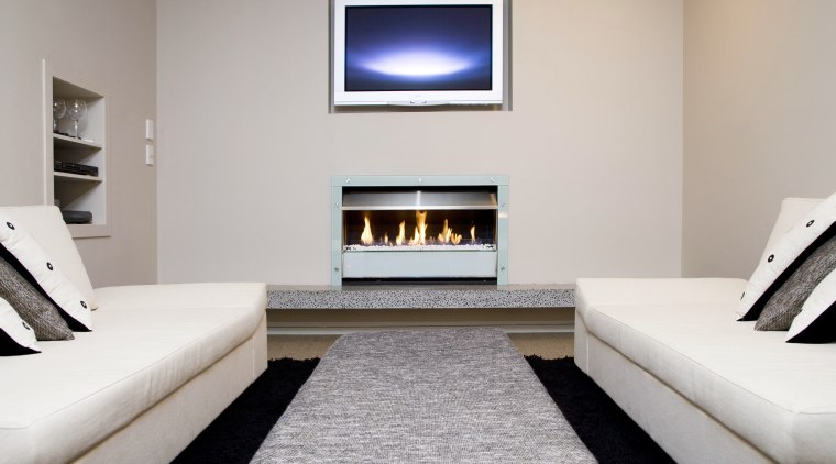 View of a lounge area which features the fireplace, hearth, interior design, living room, room, gray