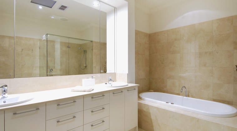View of the bathroom of a home which bathroom, bathroom accessory, bathroom cabinet, floor, home, interior design, property, real estate, room, sink, tile, gray