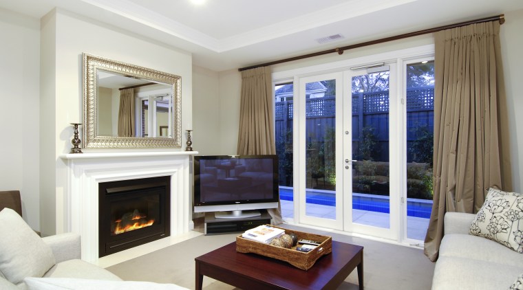 View of the living area of a home ceiling, interior design, living room, property, real estate, room, window, white