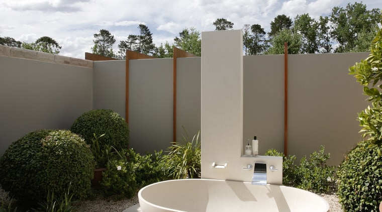 View of an outdoor freestanding bathtub and shower architecture, backyard, estate, home, house, outdoor structure, property, real estate, white