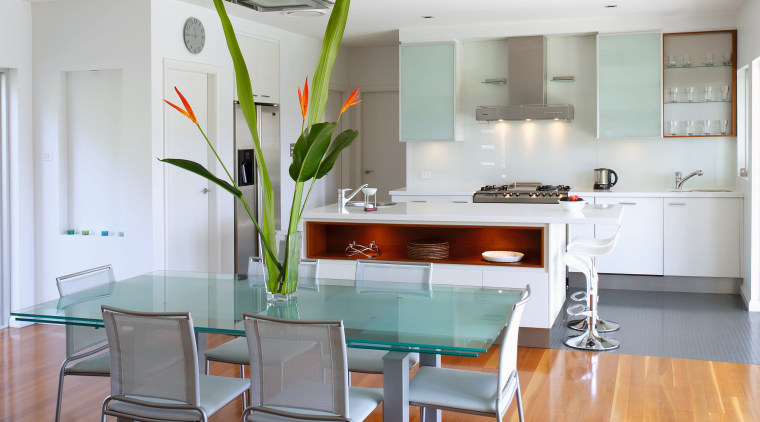 View of the dining and kitchen areas of ceiling, dining room, floor, flooring, furniture, hardwood, house, interior design, kitchen, laminate flooring, living room, real estate, room, table, wood, wood flooring, white, gray