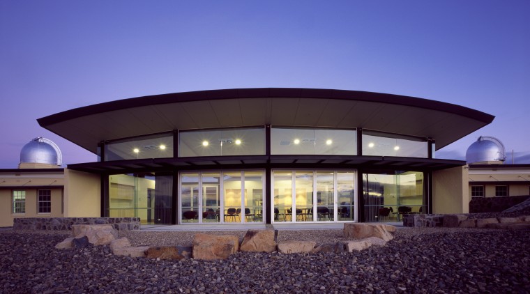 Exterior view of the observatory which features steel architecture, corporate headquarters, elevation, estate, facade, home, house, property, real estate, roof, sky, window, blue, purple