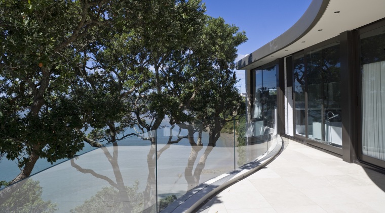 Exterior view of A Waterside house made of architecture, estate, home, house, plant, property, real estate, tree, black, gray