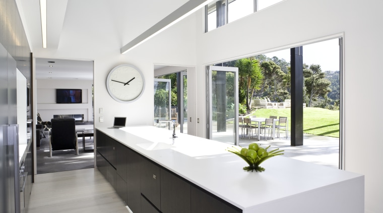 View of kitchen featuring large island, dark-stained oak architecture, house, interior design, kitchen, real estate, window, white
