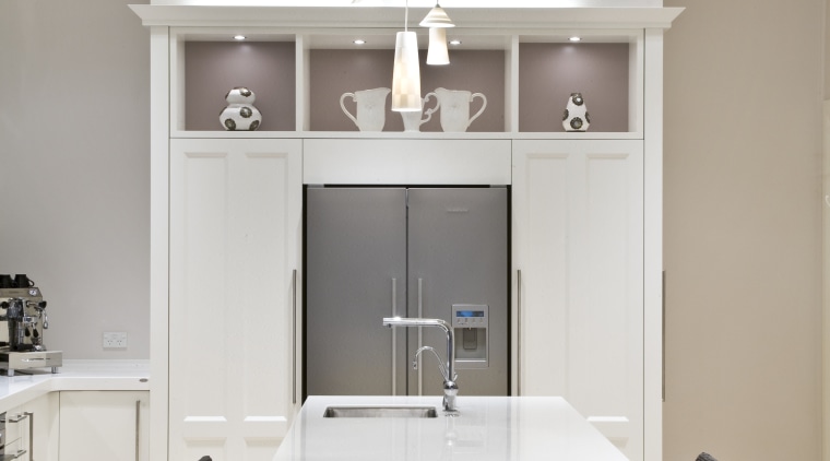 View of a renovated villa kitchen which features cabinetry, ceiling, floor, furniture, interior design, kitchen, living room, product design, room, table, gray