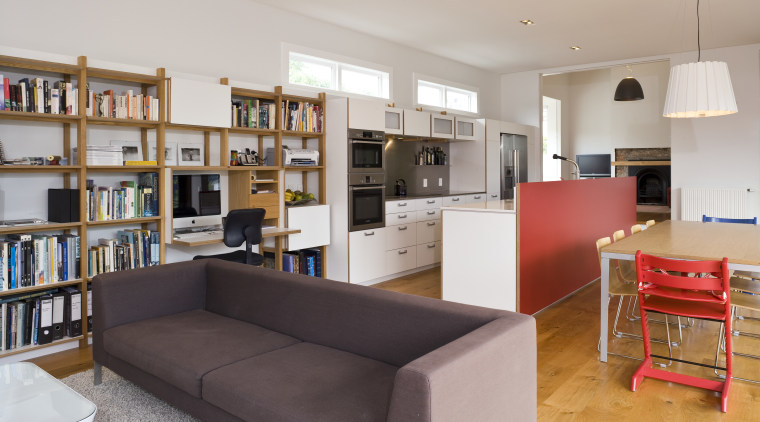 View of open-plan kitchen area which features an bookcase, furniture, institution, interior design, library, living room, real estate, room, shelving, gray