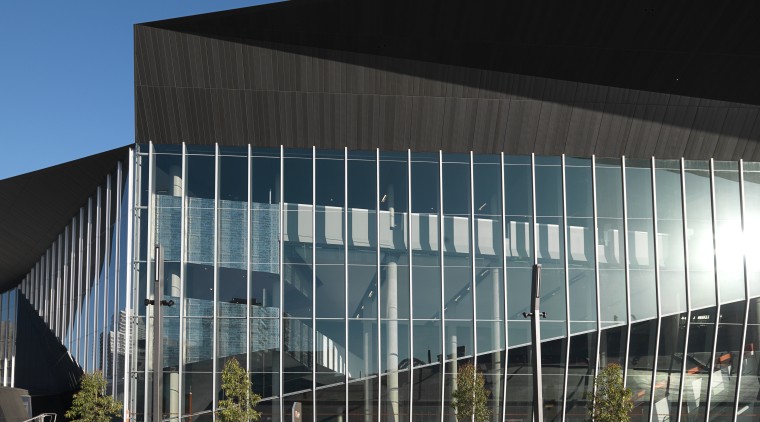 Exterior view of the Melbourne Convention Centre which architecture, building, commercial building, convention center, corporate headquarters, daylighting, daytime, facade, headquarters, metropolitan area, mixed use, reflection, sky, structure, black