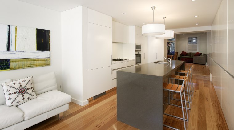 View of a narrow kitchen designed by Wonderful apartment, floor, flooring, hardwood, interior design, kitchen, laminate flooring, living room, property, real estate, room, wood flooring, white