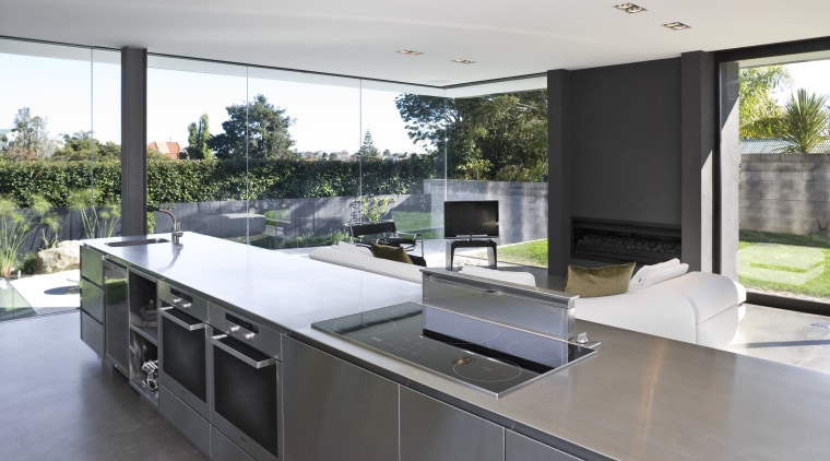 View of open-plan kitchen featuring polished concrete flooring, architecture, countertop, house, interior design, kitchen, real estate, gray, white