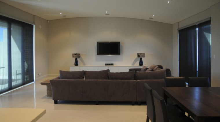 View of apartment living area at the Lindfield ceiling, floor, flooring, interior design, living room, property, real estate, room, table, wood flooring, black, gray