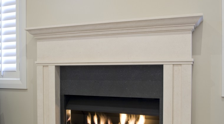 View of a hand-crafted stone mantle by The fireplace, hearth, gray