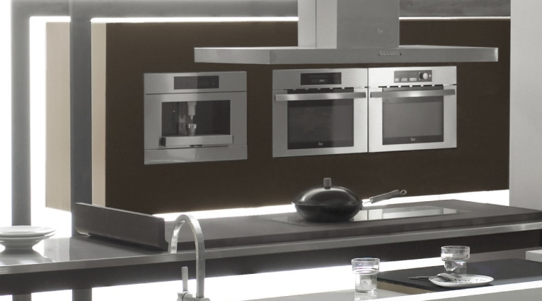 View of a modern kitchen which features appliances furniture, kitchen stove, product design, table, black, white, gray