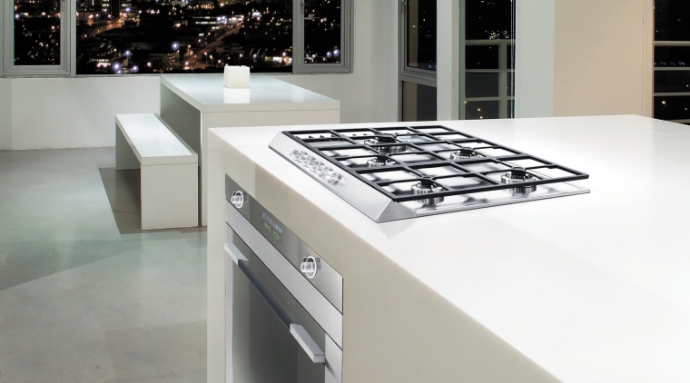 Designed by Hacker Kitchens, this kitchen features appliances countertop, floor, flooring, interior design, kitchen, product design, gray