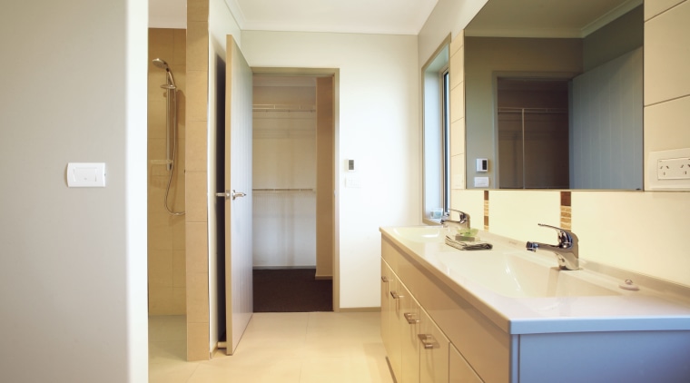View of the bathroom of this Platinum Homes bathroom, floor, home, interior design, property, real estate, room, sink, gray