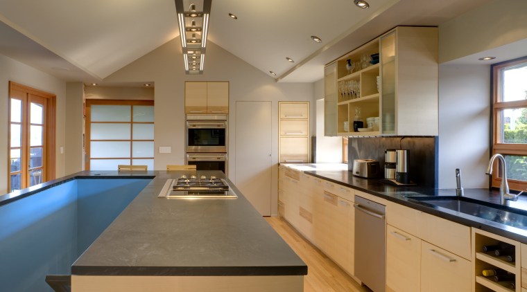 View of a kitchen which features a kitchen cabinetry, ceiling, countertop, cuisine classique, hardwood, interior design, kitchen, real estate, room, brown, orange