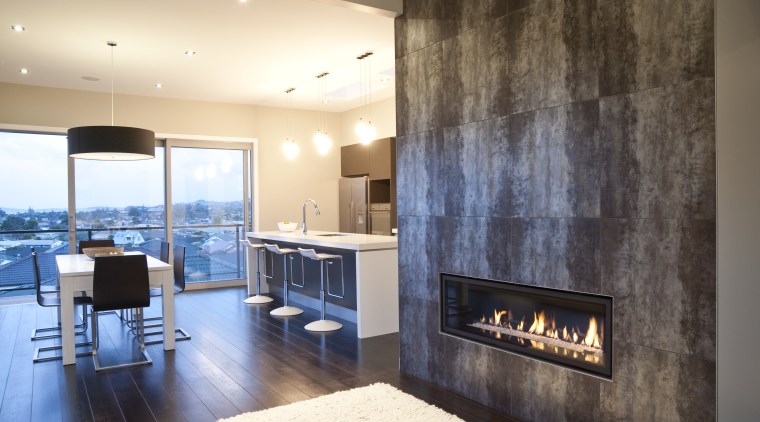 interior view of the New David Reid show ceiling, fireplace, floor, flooring, interior design, interior designer, living room, wall, orange