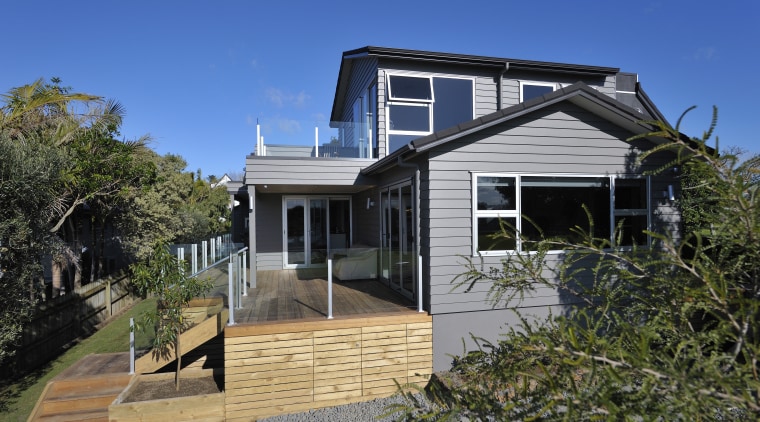 Exterior view of a home built by Keola architecture, building, cottage, elevation, estate, facade, home, house, property, real estate, residential area, roof, siding, window, blue