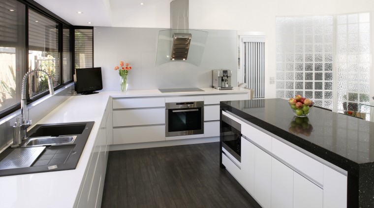 With a fully integrated kitchen design, appliances are cabinetry, countertop, cuisine classique, interior design, kitchen, real estate, white