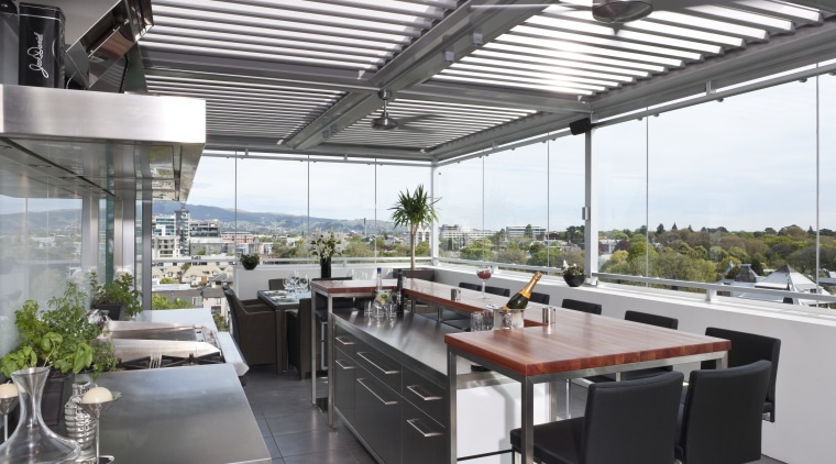 The commercial look of the kitchen is reinforced interior design, real estate, roof, white, gray