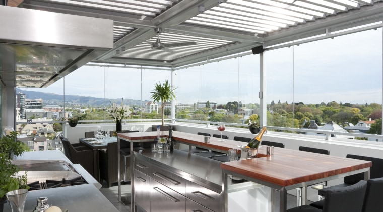 The commercial look of the kitchen is reinforced daylighting, interior design, real estate, roof, white, gray