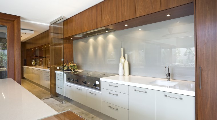 View of kitchen featuring teak cabinetry, Gaggenau oven cabinetry, countertop, cuisine classique, home, interior design, kitchen, real estate, room, brown, white, gray
