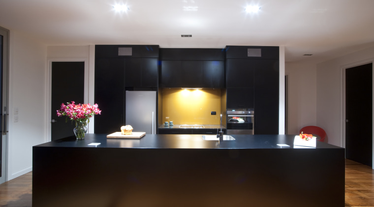 This new kitchen designed by Nicola Mason of ceiling, flooring, furniture, interior design, lighting, real estate, room, table, gray, black, brown