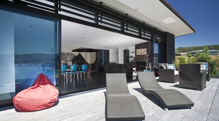 View of the outdoor living space which features architecture, home, house, interior design, property, real estate, window, gray