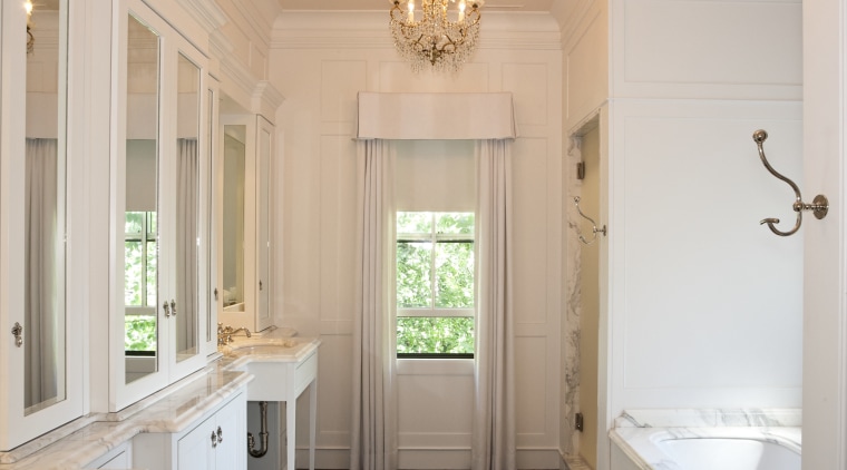 View of the master bathroom which features a ceiling, estate, floor, flooring, home, interior design, molding, room, wall, window, gray, orange