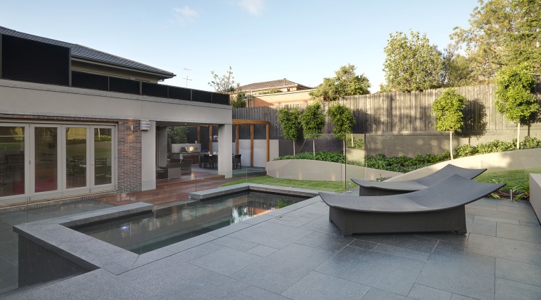 View of outdoor living space by Nathan Burkett apartment, architecture, backyard, condominium, courtyard, estate, home, house, property, real estate, residential area, swimming pool, villa, gray