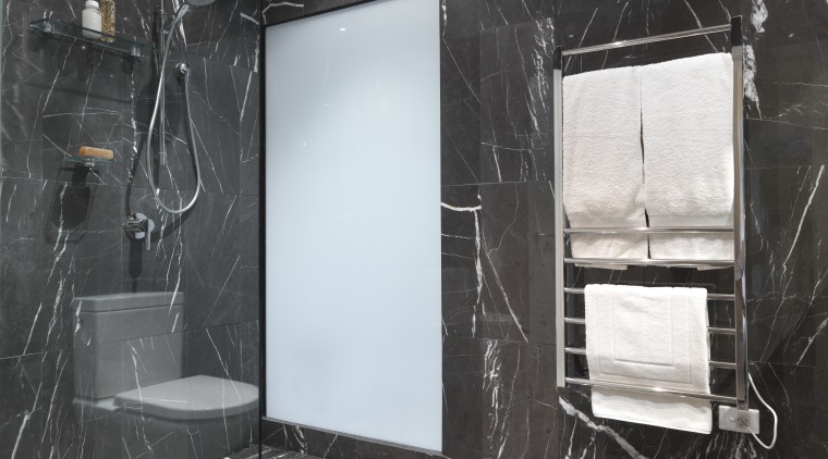 View of bathroom which features chocolate-coloured marble floor bathroom, ceiling, floor, flooring, glass, interior design, room, tile, wall, black, gray