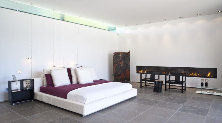 Contemporary bedroom with floor tiles and fireplace architecture, bed frame, bedroom, ceiling, floor, furniture, interior design, real estate, room, suite, wall, white, gray