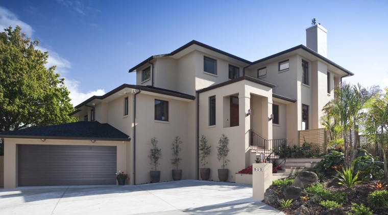 Exterior view of a home designed by Town building, elevation, estate, facade, home, house, neighbourhood, property, real estate, residential area, sky, villa