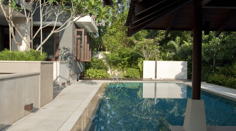 View of the outdoor pool area which features architecture, backyard, estate, house, leisure, outdoor structure, property, real estate, resort, swimming pool, water, gray, black