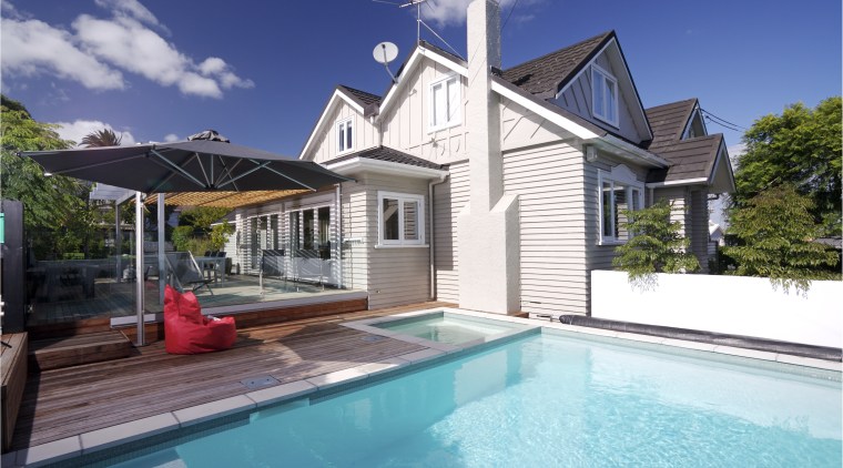 View of an outdoor area which features a cottage, estate, facade, home, house, property, real estate, residential area, swimming pool, villa