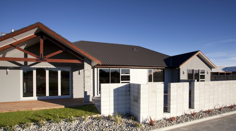 Exterior view of a David Reid Homes show building, cottage, elevation, estate, facade, home, house, property, real estate, residential area, roof, siding, blue